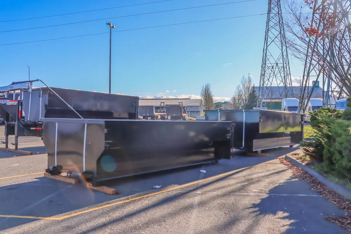 Roll-off dumpster ready for waste disposal at job site for Construction Dumpster Rental in Forest Hills